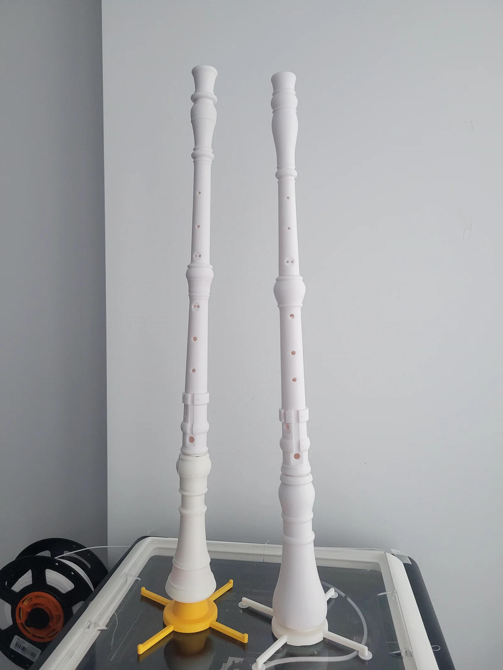 3D-printed recorders beside the resin printer
